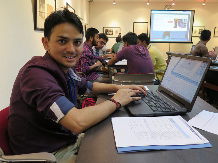 Policy Hack participant on his computer.