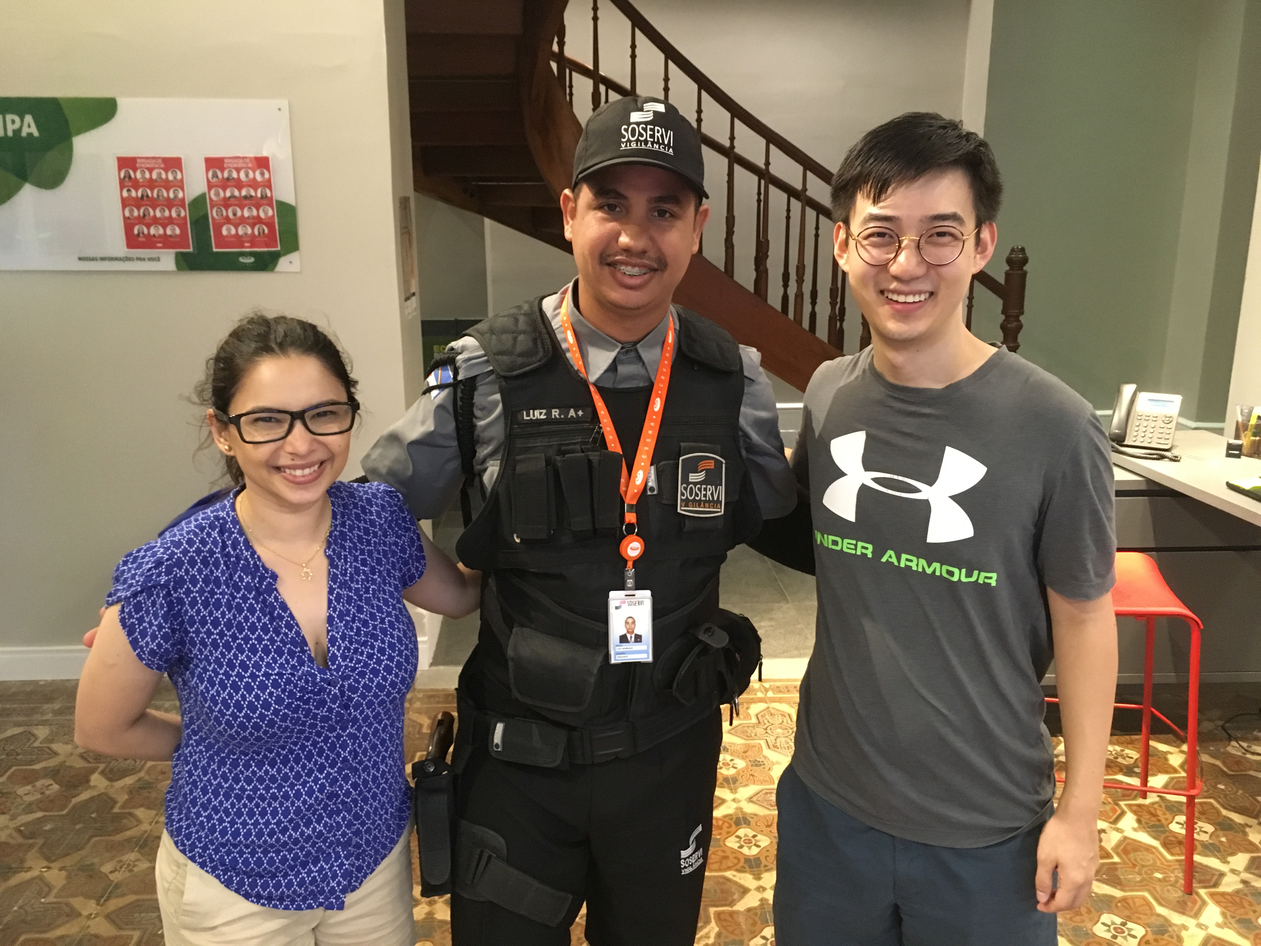 Mayara Felix (L) and her coauthor Michael B. Wong (R) with a security guard in Recife, Brazil, the site of their field work, September 2019.