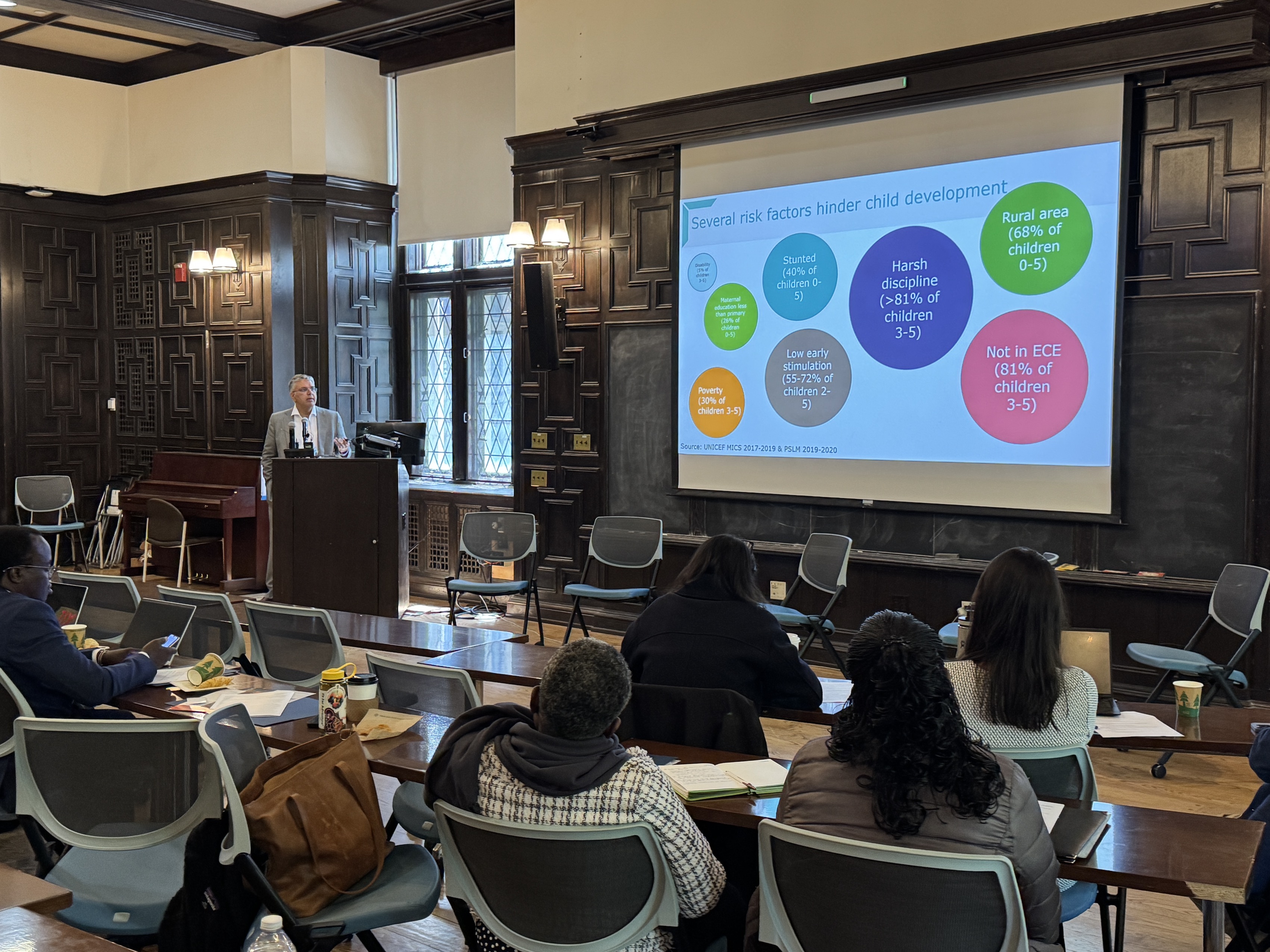 Amer Hasan presenting insights from his work at an event at Yale.