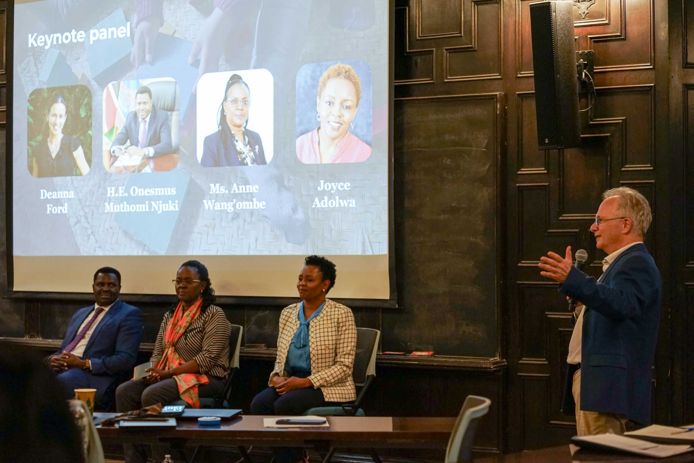 Costas Meghir (on the right) sharing remarks at the May 7 Yale event during the keynote panel session, featuring senior policymakers and practitioners – H.E. Onesmus Muthomi Njuki, Madam Anne Wang'ombe, and Joyce Adolwa – and YIE managing director Deanna Ford as the moderator.