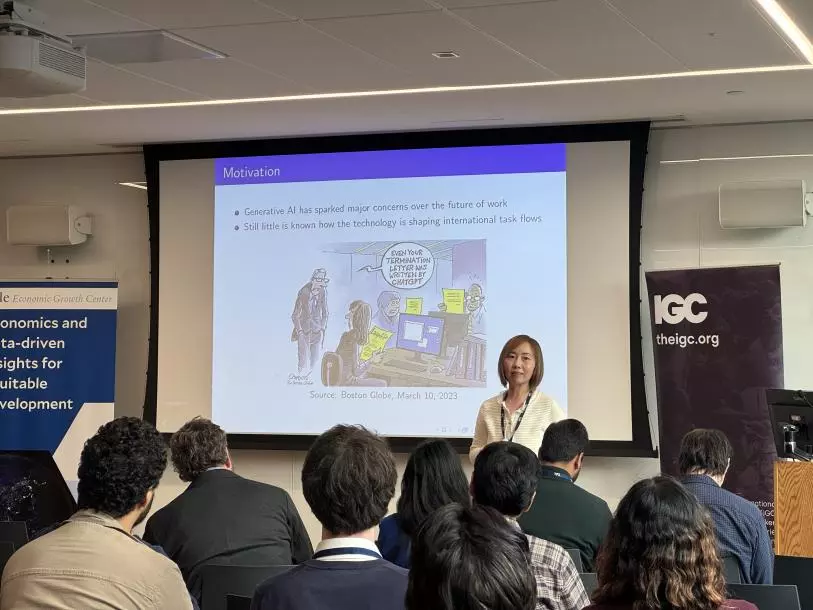 Maggie Chen presenting at the Firms, Trade and Development Conference
