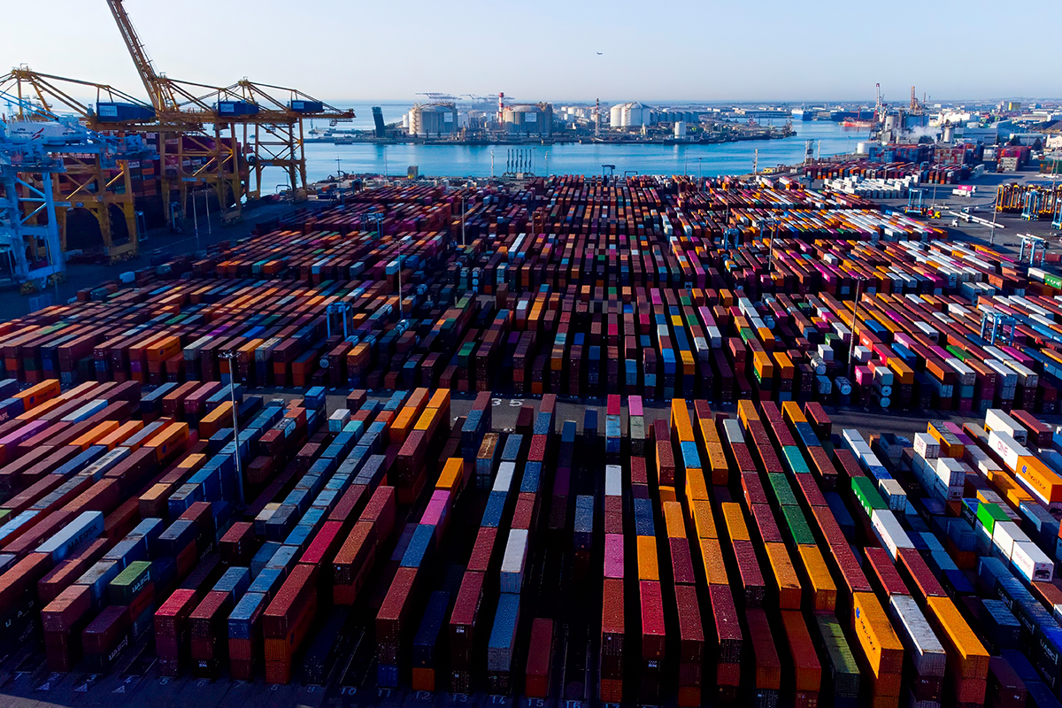 Barcelona, Spain- 5 February 2025: Aerial view of shipping containers and cargo ships in the sea port of Barcelona in Spain, Europe. 