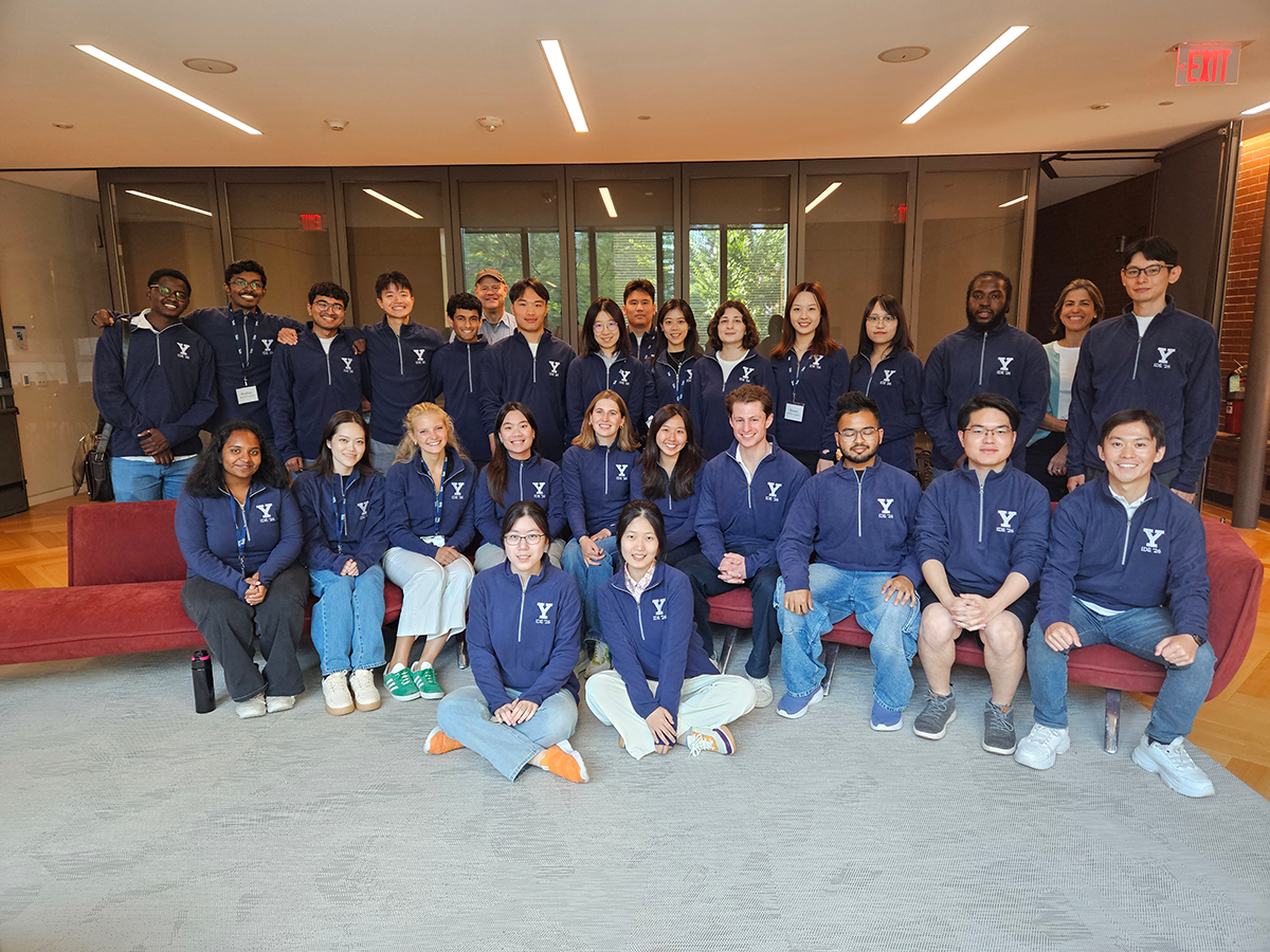 A group of students in matching blue jackets