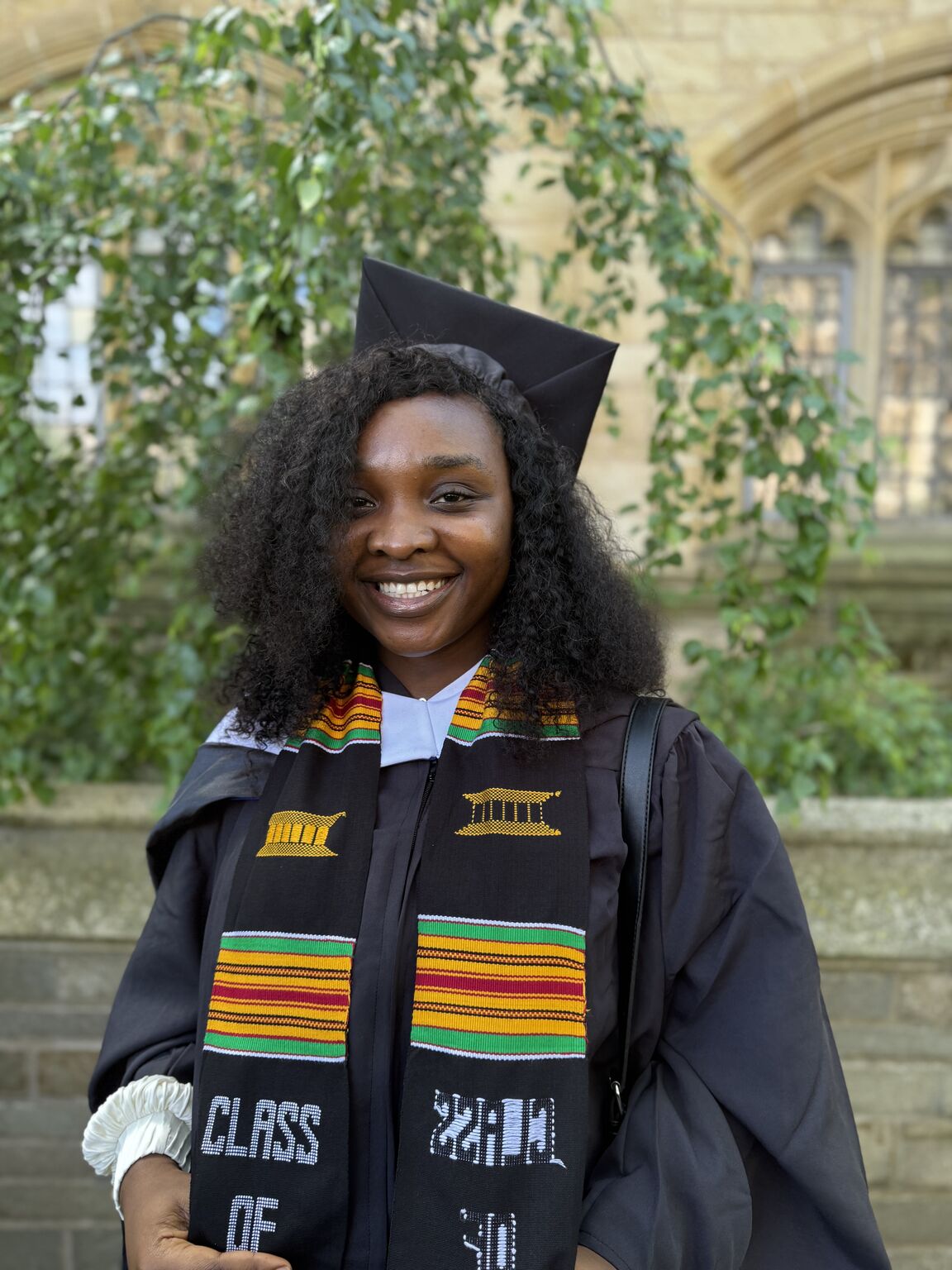 A woman in graduation robes