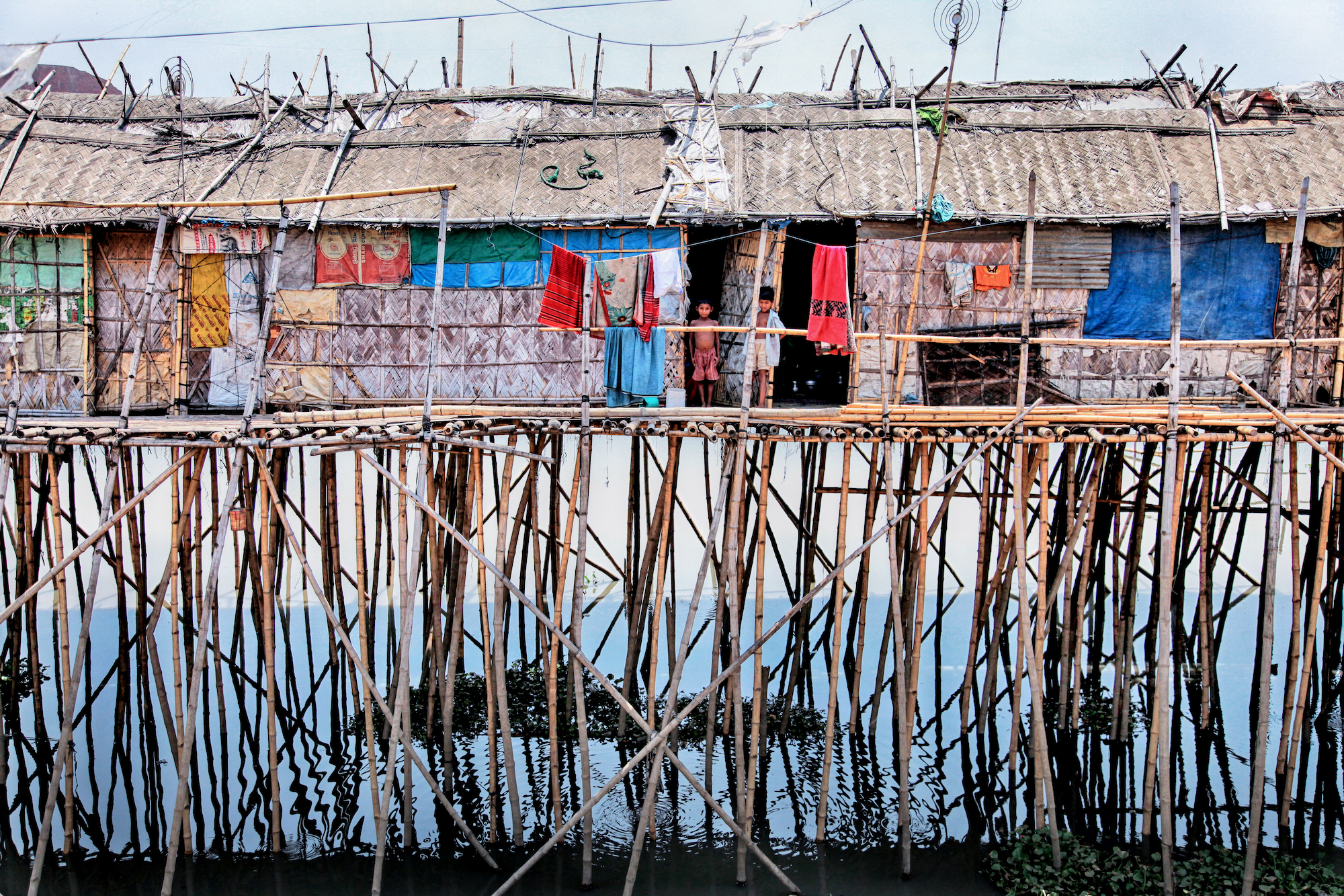 Houses on stilts in a river in Bangladesh