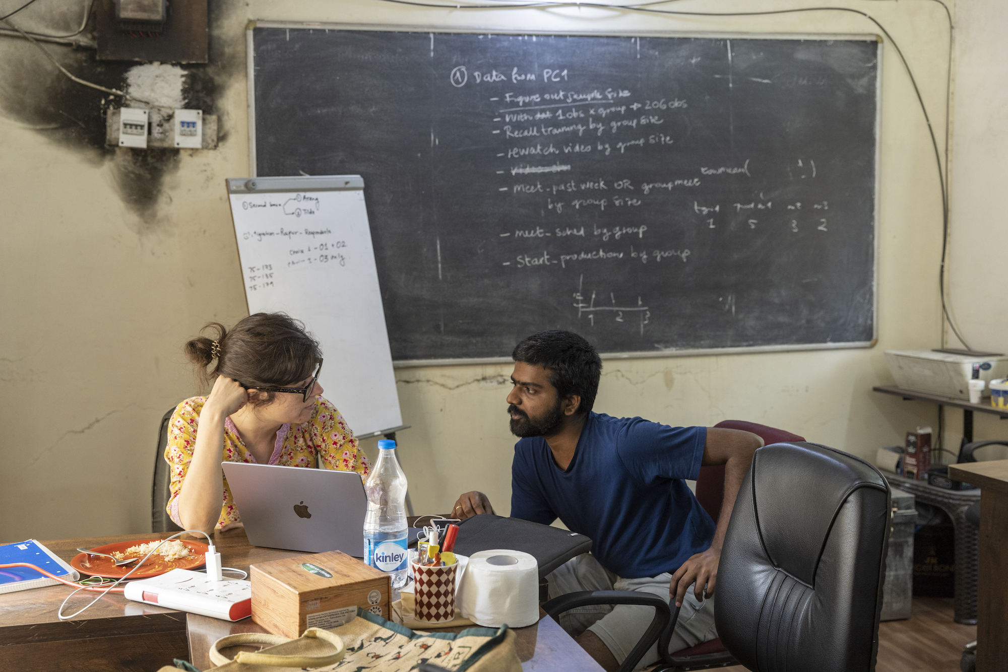 two researchers in an office in India