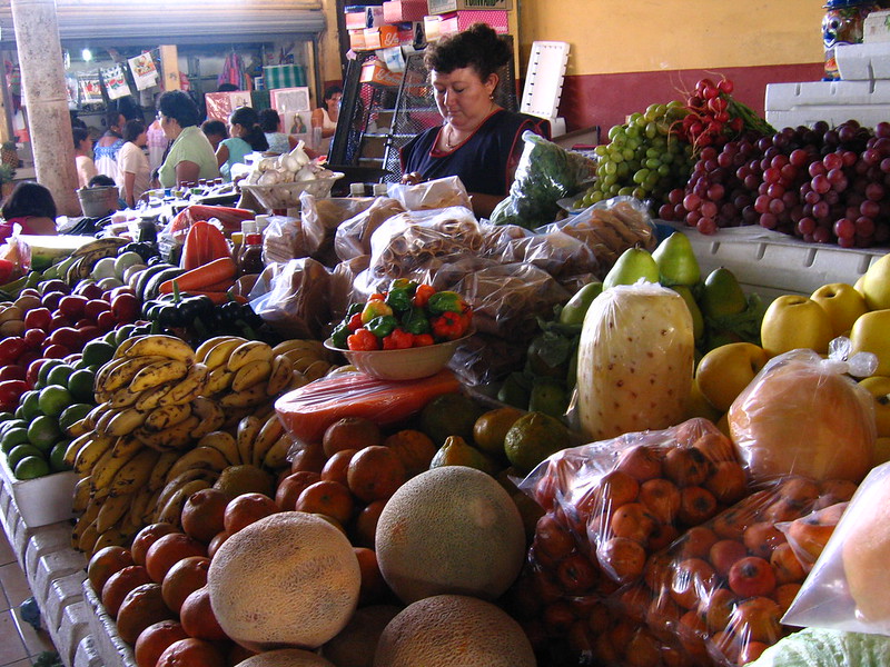 A fruit vendor in a rural market