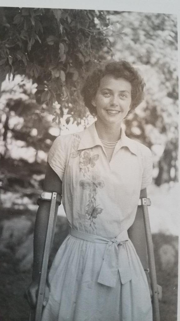 Cynthia posing for a photo at her graduation from Vassar College