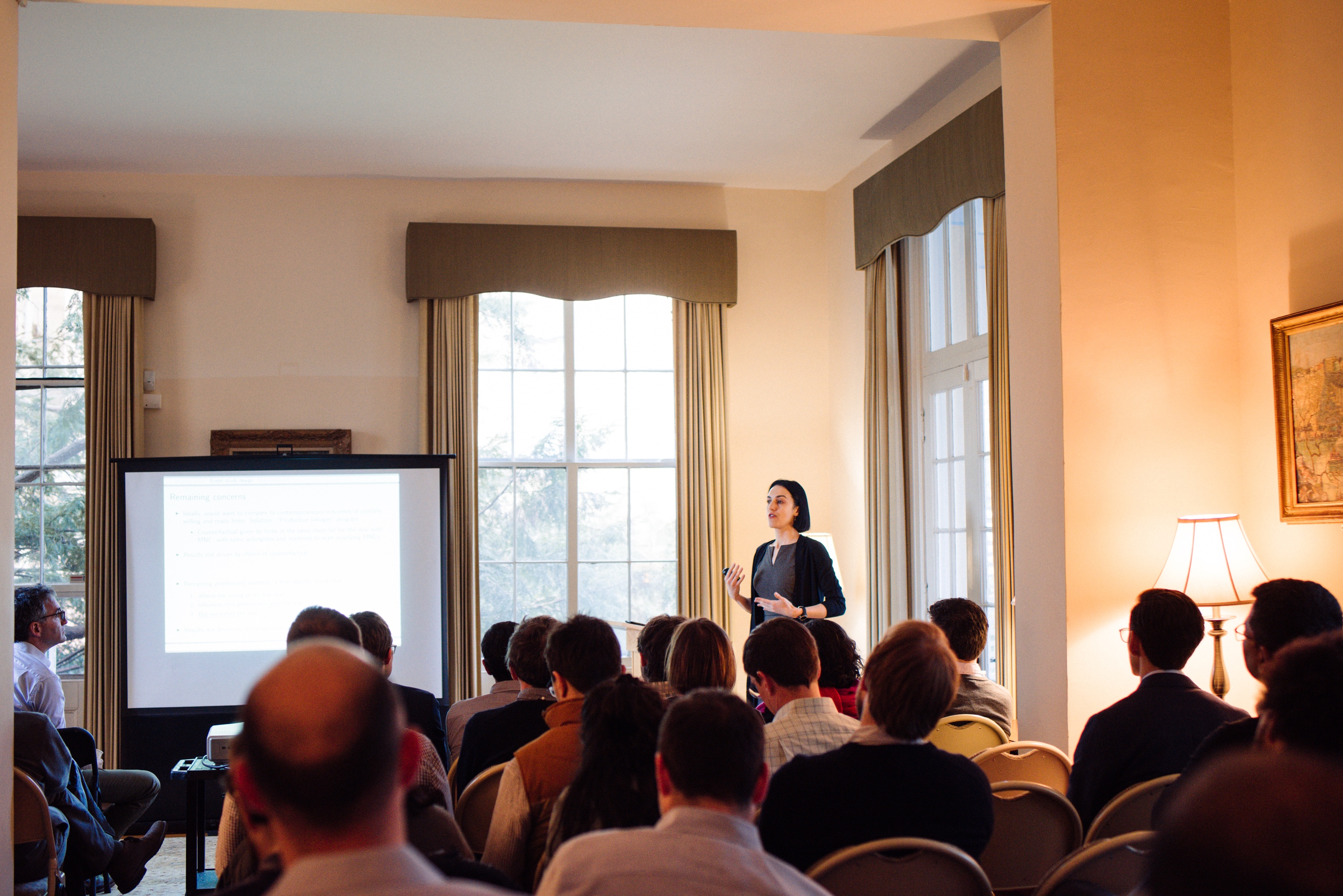 Isabela Manelici speaking in front of a large group.