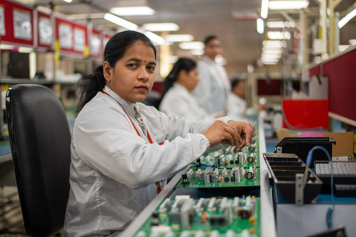 Photo of an Indian woman in a lab. Photo by PradeepGaurs, Shutterstock.