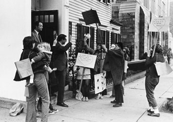 A group of young women holding picket signs protest outside Mory's restaurant in the 1960s 