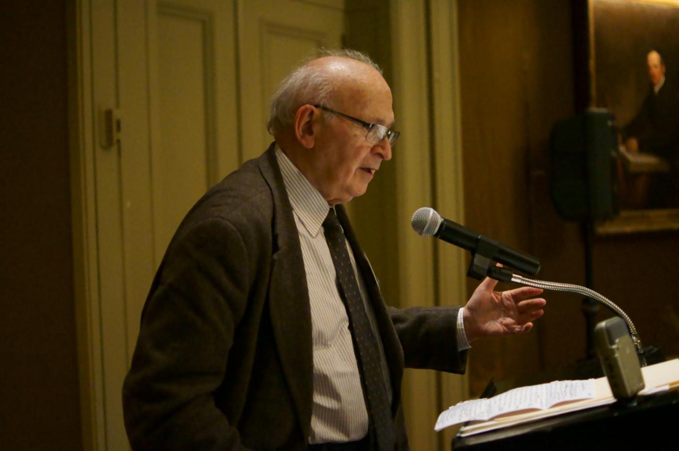 Gus Ranis speaking at the lectern