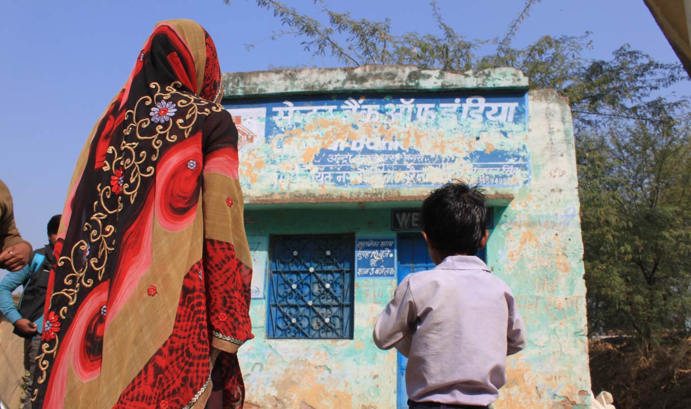 Woman and child looking at building