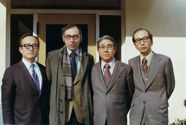 A photo of four men in suits, Paul Kuznets and three colleagues from the Bank of Korea