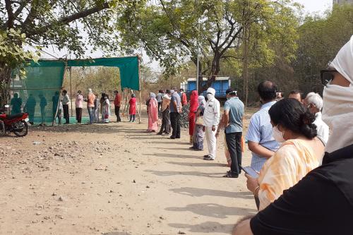 A line of people waiting for Covid vaccinations