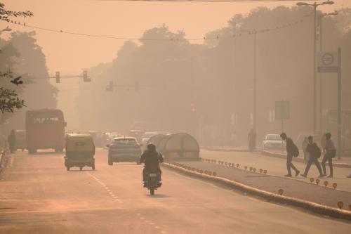 Vehicles driving through heavy pollution