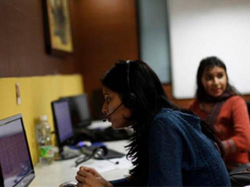 Two Indian women working in a call center.