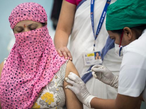 A women receives the vaccine injection.
