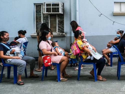 Women and children wait in line for vaccines. Veejay Villafranca/Asian Development Bank, Flickr
