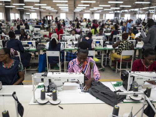 Workers sew fabric at a DTRT apparel factory in Ghana