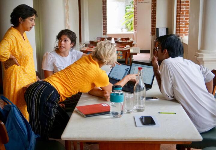 Image showing members from the IE team working together