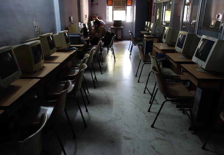 Empty classroom with computers.