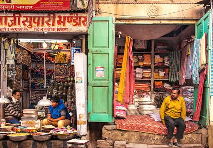 Indian men in their shops.