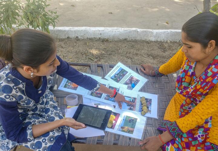 Female researcher conducting a 'Hybrid’ method interview with female participant.