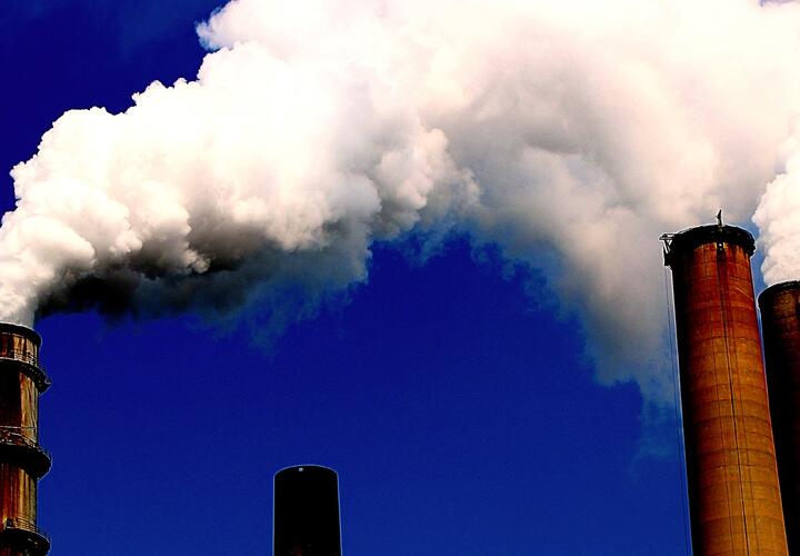 A color image of several smoke stacks.