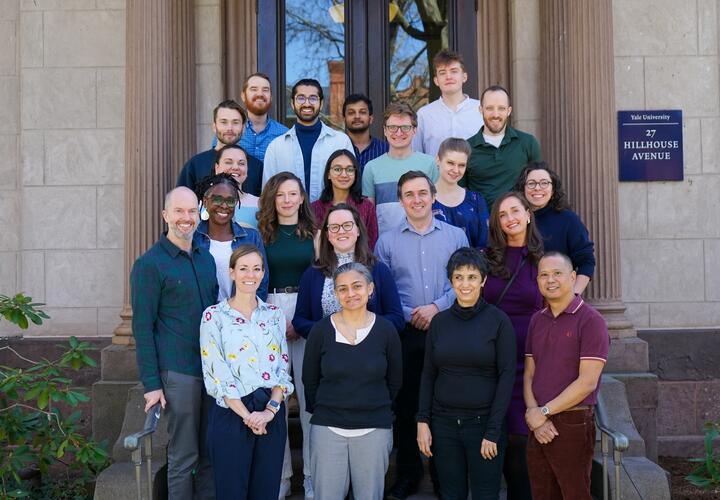 Group photo of EGC and YIE staff, standing outside 27 HH.