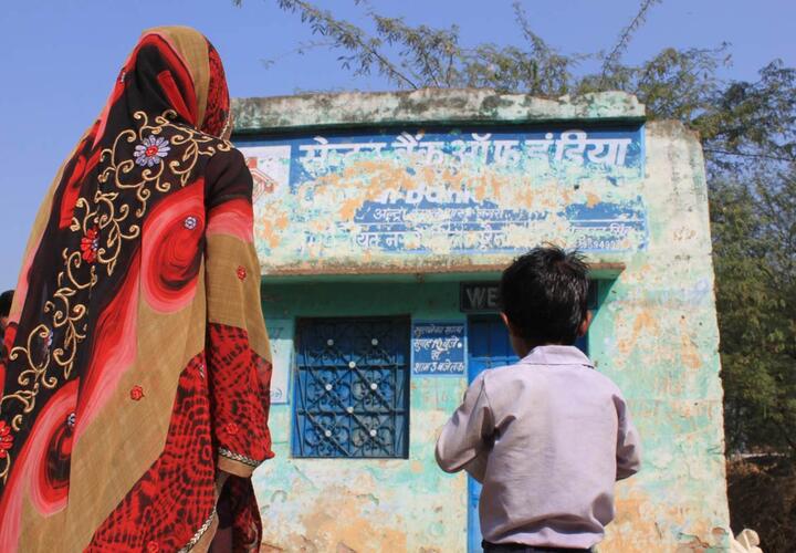 Woman and child looking at building