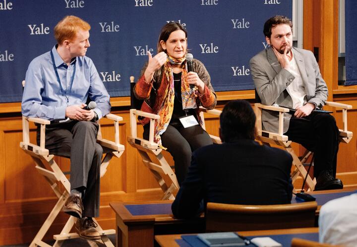 Nicholas Ryan, Esther Duflo, and Lucas Chancel on stage 