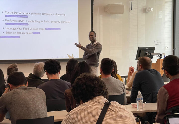 Augustin Tapsoba, Assistant Professor of Economics at the Toulouse School of Economics, presents at EGC's Development Lunch on March 6, 2023