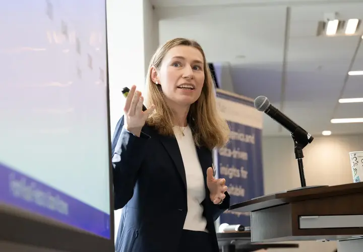 A PhD graduate presenting with slides