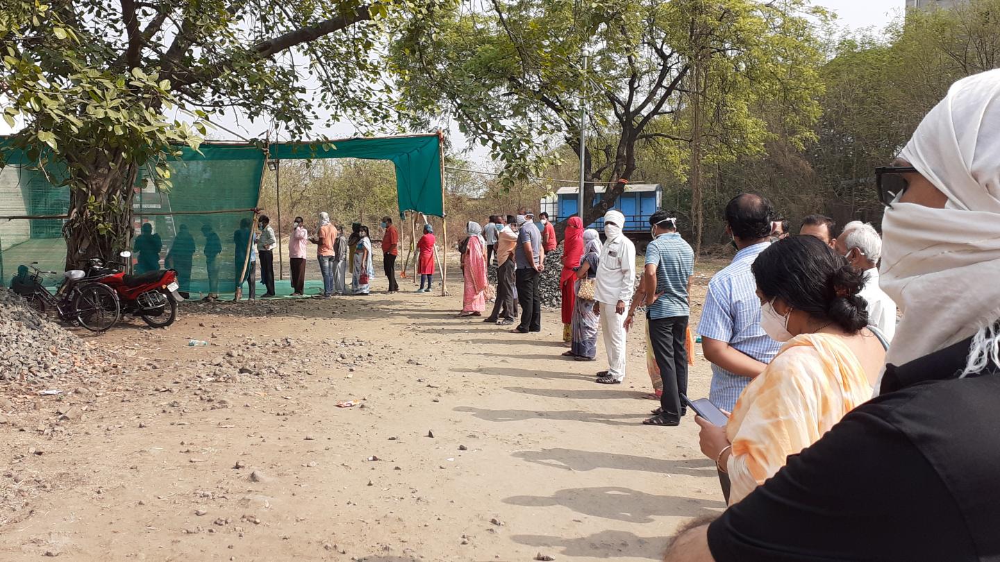 A line of people waiting for Covid vaccination in India